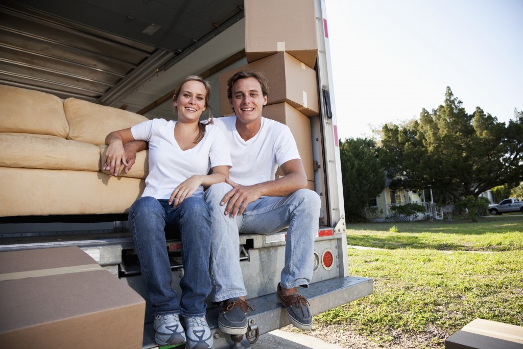 Young couple moving house, taking a break